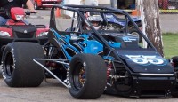 Spartan Speedway held it's first non wing sprint car event of the year Friday and a large crowd witnessed a little history as 15 year old Taylor Ferns took the checkers in her first ever sprint car event.