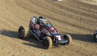 Clauson Claws to “Smackdown” Night one Win From MudclodBob/Dick Jordan Dave Darland started outside the front row and looked like a sure winner for the first half of the 30 lap feature to kickoff the “Sprint Car...