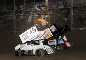 The checkered flag flies upon Henry Van Dam in Monday night's ASCS Northwest Speedweek opener at Southern Oregon Speedway. (Lonnie Wheatley)
