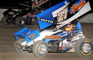 Craig Dollansky (#7) racing with Daryn Pittman (#27) for the lead at Volusia Speedway Park. - Lonnie Wheatley Photo