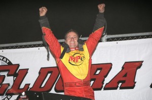 Tracy HInes enthusiastically exits his car in victory lane at Eldora Speedway after winning the Jud Larson / Don Branson Clasic to kick off Border Wars with the USAC National Sprint Car Series. - Jan Dunlap Photo