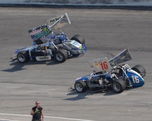 #16 Paul White and #5 Sondi Eden battle during the 30 lap supermodified feature event. - Bill Miller Photo