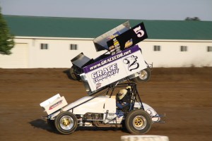 Brian Smith (2+) racing with Byron Reed (#5R) Friday at Attica Raceway Park. - Action Photos