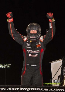 Jason Meyers celebrates winning the Thursday night feature at the Knoxville Nationals. - Mike Campbell/campbellphoto.com