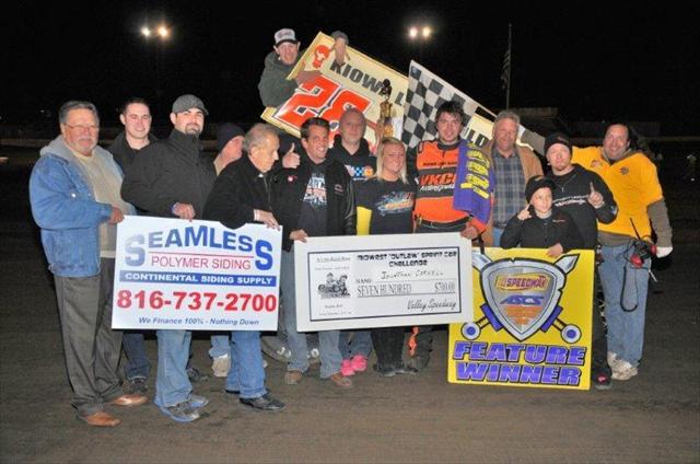 Jonathan Cornell with family and his team celebrating a victory and championship at Valley Speedway on Friday. - John Lee Photo