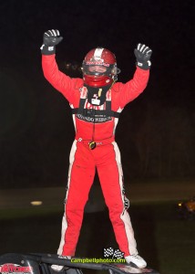 Kevin Thomas, Jr. up on the cage after winning Friday night's USAC Amsoil National Sprint Car Series feature at Gas City I-69 Speedway. - Mike Campbell Photo