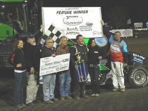 Russ Hall with family and crew members in victory lane. - Image courtesy of the Sprint Invaders