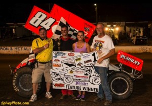 Alex DeCamp enjoys the spoils of victory lane. - Mike Spivey Photo
