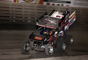 Mark Dobmeier catching and passing Danny Lasoski for the lead in lapped traffic during Saturday night's 410 sprint car feature at Knoxville Raceway. - Serena Dalhamer Photo