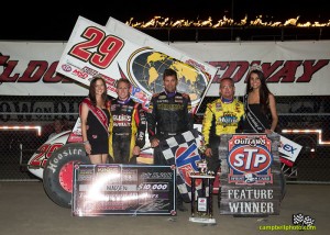 The top three from Friday night's feature (l to r):  Second place Brad Sweet, winner Kerry Madsen, and third place Joey Saldana. - Mike Campbell Photo