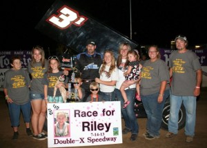 Bryan Grimes of Slater MO celebrates his victory at Double-X Speedway. - Carol Wirts Photo