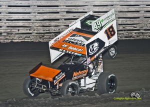 Ian Madsen (#18) inside of Josh Schneiderman on Wednesday at Knoxville Raceway. - Mike Campbell Photo