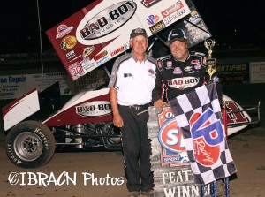 Steve Kinser is joined by Junction Motor Speedway track owner Delmar Friesen after winning the WoO feature on Tuesday night. - Brad Brown / IBRACN.com Photo