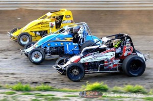 Adam Cruea (#83), Mike Brecht (#9x) and Dallas Hewitt (#2H) race three wide at Waynesfield Raceway Park. - Jan Dunlap Photo