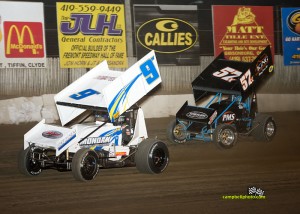 Jac Haudenschild (#9) inside of Andrew Palker (#57x) at Fremont Speedway. - MIke Campbell Photo