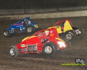 Tony Main (#74), Brandon Whited (#15) and Kody Swanson (#12) racing for position on Saturday at Eldora Speedway. - Mike Campbell Photo