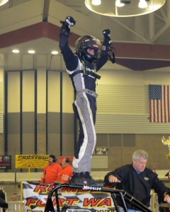Justin Peck celebrates winning the Rumble Racing Series event at the Memorial Coliseum Expo Center on Saturday night December 28, 2013. - Bill Miller Photo