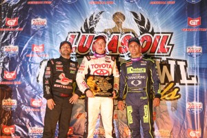 (l to r)Second place Damion Gardner, winner Christopher Bell, and third place Michael Pickens in victory lane after Thursday night at the Chili Bowl Nationals. - James McDonald / Apexonephoto