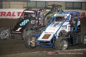 Alex Sewell (#8) and Sammy Swindell (#1) racing for position Wednesday at the Chili Bowl Nationals. - Serena Dalhamer PHoto