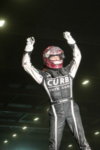 Bryan Clauson emerges from his car victorious. - James McDonals / Apexonephoto