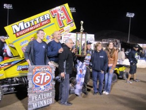 Veterans from the Workshops for Warriors, along with Doug Harris, president and CEO of HE&M Saw, and his wife join Saldana in the victory celebration