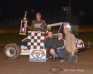 Shane Cottle and crew celebrate winning the 25 lap non-wing sprint car feature event at the Gas City I-69 Speedway. - Bill Miller Photo