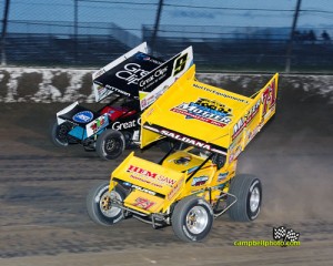 Joey Saldana (#71) slides Daryn Pittman (#9) Saturday at Eldora Speedway. - Mike Campbell Photo