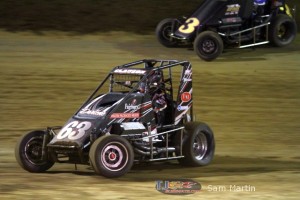 Bryan Clauson (#63) inside of Chris Windom (#3) Saturday at Belle-Clair Speedway. - Sam Martin Photo