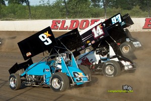 Rob Chaney (#9x), Dale Blaney (14K), and Sheldon Haudenschild (#93) racing three wide at Eldora Speedway. - Mike Campbell Photo