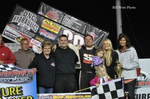 Greg Wilson with this family and crew after winning the SOD/NRA portion of the Bob Reynolds Memorial Race  at Waynesfield Raceway Park. - Bill Weir Photo