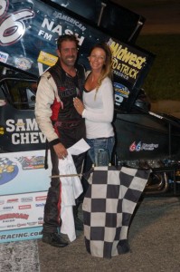 Aaron Pierce celebrates with his wife Amy after winning the Must See Racing MOFAB Labor Day 200 Saturday night at Anderson Speedway. - David Sink Photo