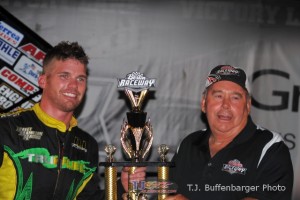 Troy DeCaire receiving the trophy for winning Saturday night's Must See Racing feature at Berlin Raceway. - T.J. Buffenbarger Photo