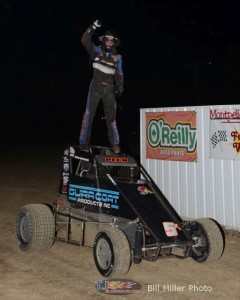 Justin Peck up on the cage after winning Saturday night's midget car feature at Montpelier Motor Speedway. - Bill Miller Photo