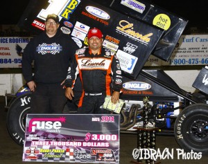 Danny Lasoski won the Bobby Parker Memorial Nebraska 360 Sprint car feature at I-80 Speedway and took home the $3,000 in two dollar bills. - Brad Brown / IBRACN Photo