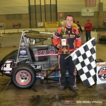 Anthony Nocella celebrates winning the 50 lap Rumble Racing Series event at the Memorial Coliseum Expo Center on Friday night December 26, 2014. - Bill Miller Photo