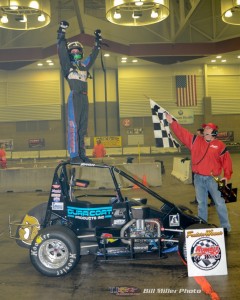 Justin Peck celebrates winning the 50 lap Rumble Racing Series event at the Memorial Coliseum Expo Center on Saturday night December 27, 2014. - Bill Miller Photo