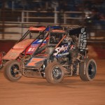 Nathan Smee under another competitor at Valvoline Raceway. (Image courtesy of Sydney Speedway)