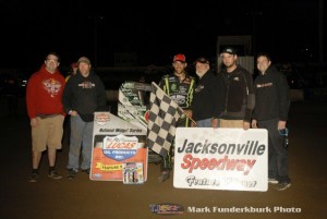 Bryan Clauson with his family and crew in victory lane Friday after winning the POWRi midget car series feature at Jacksonville Speedway. (Mark Funderburk Photo)