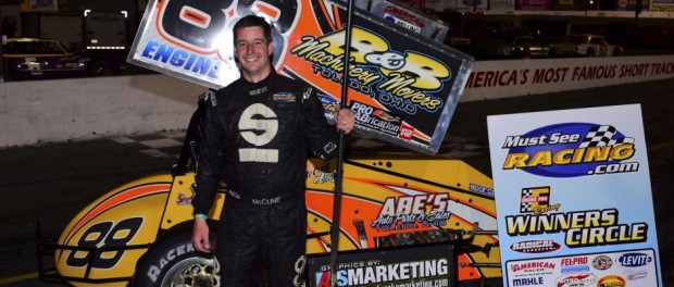 Jimmy McCune holding a broom in victory lane following his second victory of the weekend with the Must See Racing sprint car series. (Chris Seelman Photo)