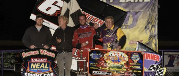 Ryan Bunton with his team in victory lane following their victory Friday night at Granite City Speedway with the MOWA sprint cars. (Mark Funderburk Photo)