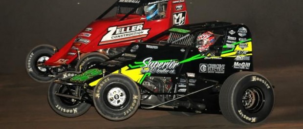 Chase Stockon, of Haubstadt, Indiana, (inside) makes the pass on Thomas Meseraull for the lead on lap 12 of Saturday night's "Spring Showdown" at Tri-State Speedway in Haubstadt, Indiana. (David Nearpass Photo)