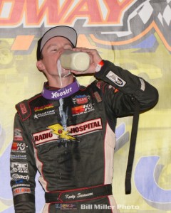 Kody Swanson taking the traditional drink of milk. (Bill Miller Photo)