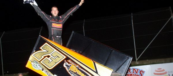 Chris Andrews celebrates following his victory Friday night at Attica Raceway Park. (Action Photo)