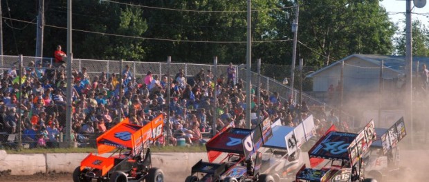 Three wide into turn one during heat race action in front of a full house at Thunderbird Raceway. (T.J. Buffenbarger Photo)