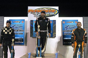 Shepherd Firearms Pro Sprints Feature winner Kevin Atkins (center), Zane DeVault (left) and Michael Summers (right).  Photo by Greg Hildebrand 