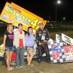 Dylan Westbrook poses in victory lane with representatives from night sponsor Rapid Rad. (Rod Henderson photo). 