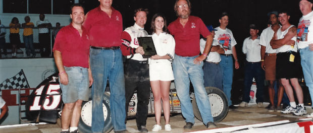 Billy Boat (third from left) and John Lawson (on right in red shirt) celebrate in victory lane after winning a USAC National Midget feature at Indiana's Terre Haute Action Track in 1997.