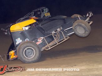 Mike Galajda’s car with the front wheels up after spinning at I-96 Speedway. (Jim Denhamer Photo)