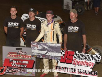 Cannon McIntosh with his crew in victory lane Friday at Jacksonville Speedway. (Mark Funderburk photo)