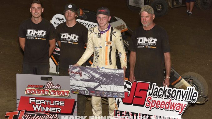 Cannon McIntosh with his crew in victory lane Friday at Jacksonville Speedway. (Mark Funderburk photo)